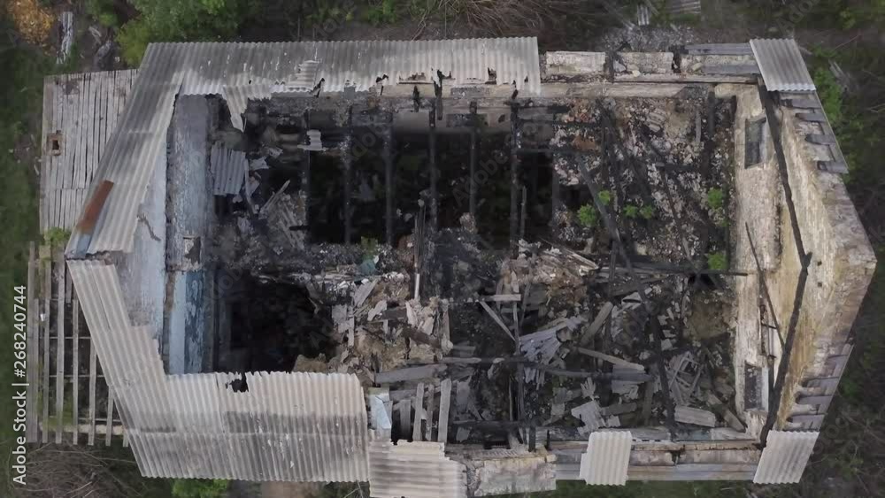 Aerial view. Old ruined building. Abandoned house. Dismantling the building structure. Demolition of the ruins on the outskirts of the city Aerial view. Old ruined building. Abandoned house. Dismantling the building structure. Demolition of the ruins on the outskirts of the city