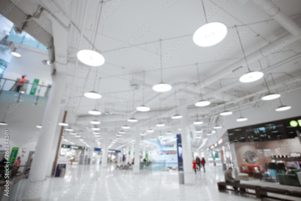 Shopping center led lighting. Ceiling lights in the mall. Retail concept.  Customers and shoppers in the store. Blurred. foto de Stock | Adobe Stock