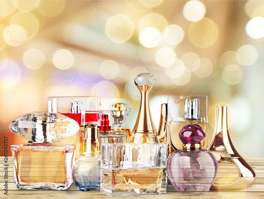 Aromatic Perfume bottles on background - obrazy, fototapety, plakaty 