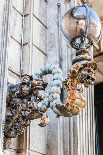 Ancient dragon shaped street lantern photo