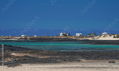 turquoise sea set among the black volcanic rock of Fuerteventura. Canary Islands - Spain