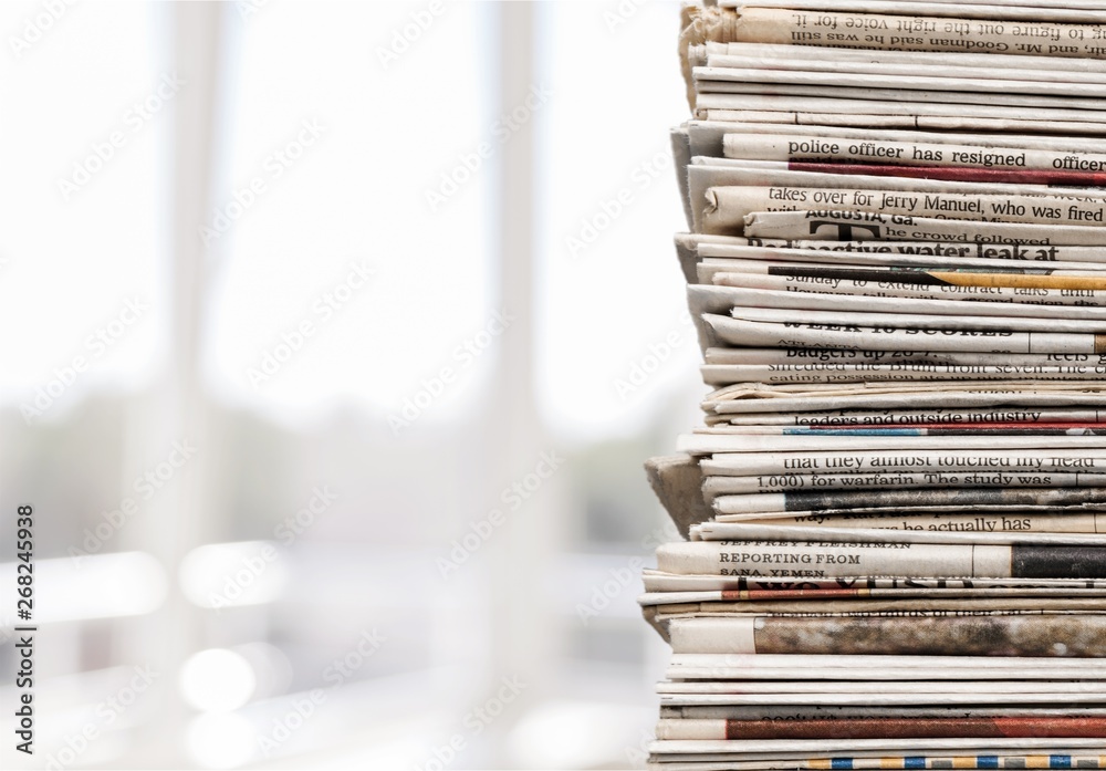 Pile of newspapers on white background Pile of newspapers on white background