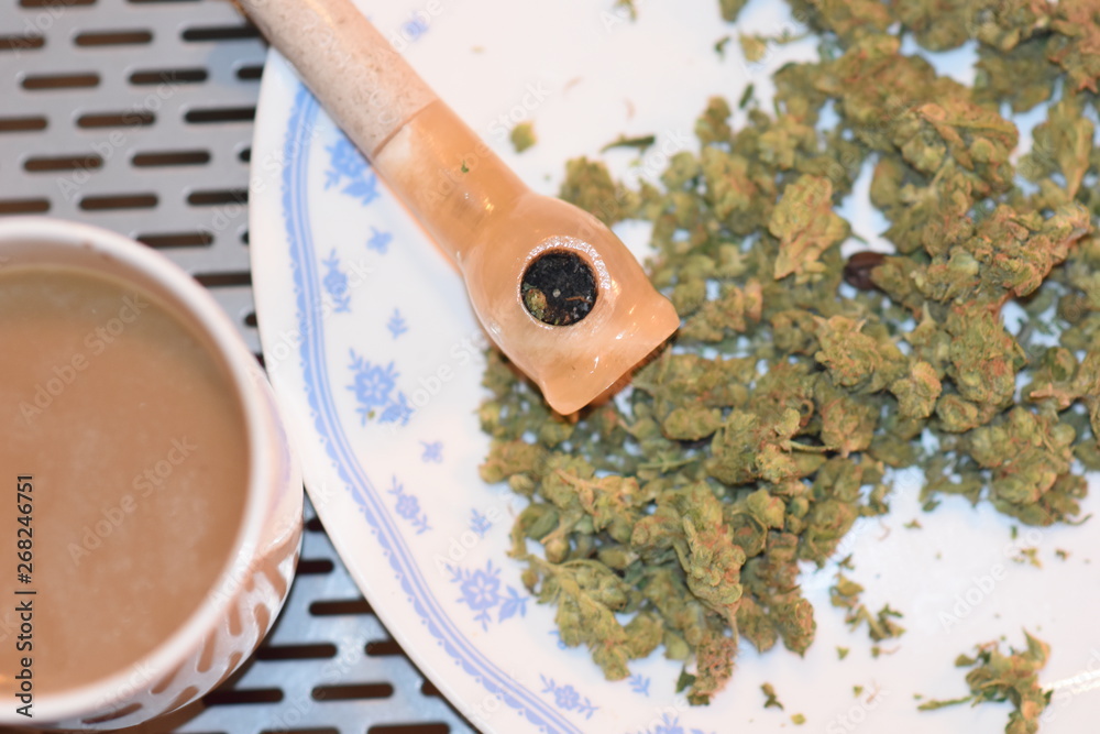 COFFEE...POT...AND PIPE.....PLATE ON STEEL TABLE COFFEE...POT...AND PIPE.....PLATE ON STEEL TABLE