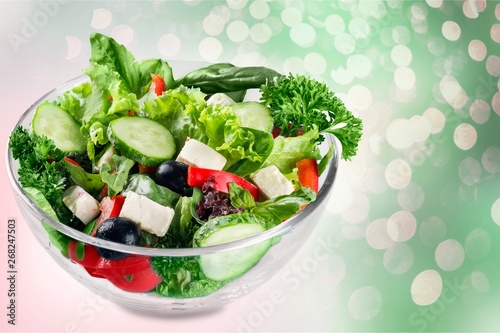 Closeup of Greek salad with feta cheese, cherry tomatoes and lettuce