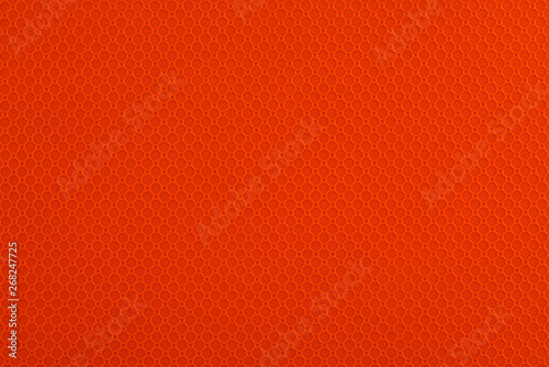 Close up on an orange abstract texture pattern as the background. Copy space for your text.