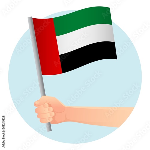 united arab emirates flag in hand