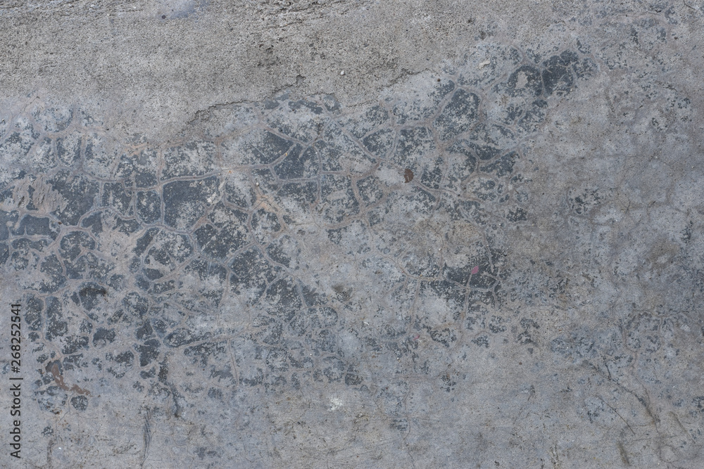 Grunge concrete wall with crack and stains in industrial building. Cement texture for design and background. Grunge concrete wall with crack and stains in industrial building. Cement texture for design and background.