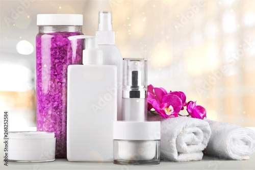 Set of cosmetic products in white containers isolated