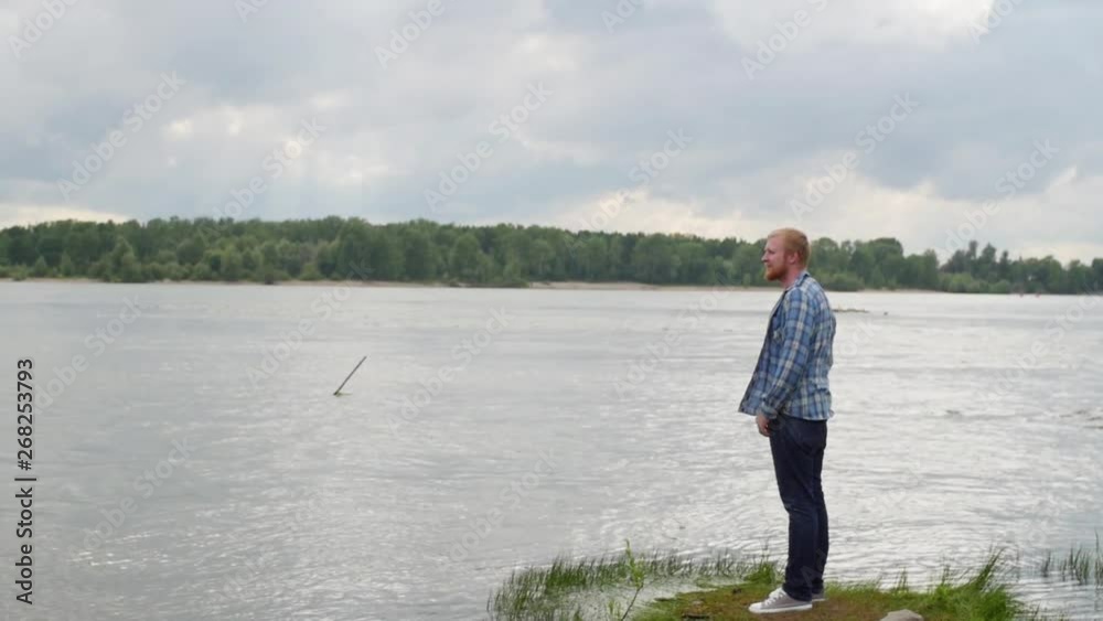 young man walks near the river. man looks at the river. tourist walks near the lake. young man walks near the river. man looks at the river. tourist walks near the lake.