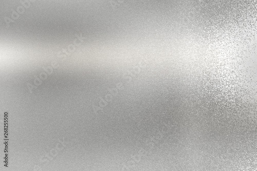 Glowing brushed silver steel plate, abstract texture background