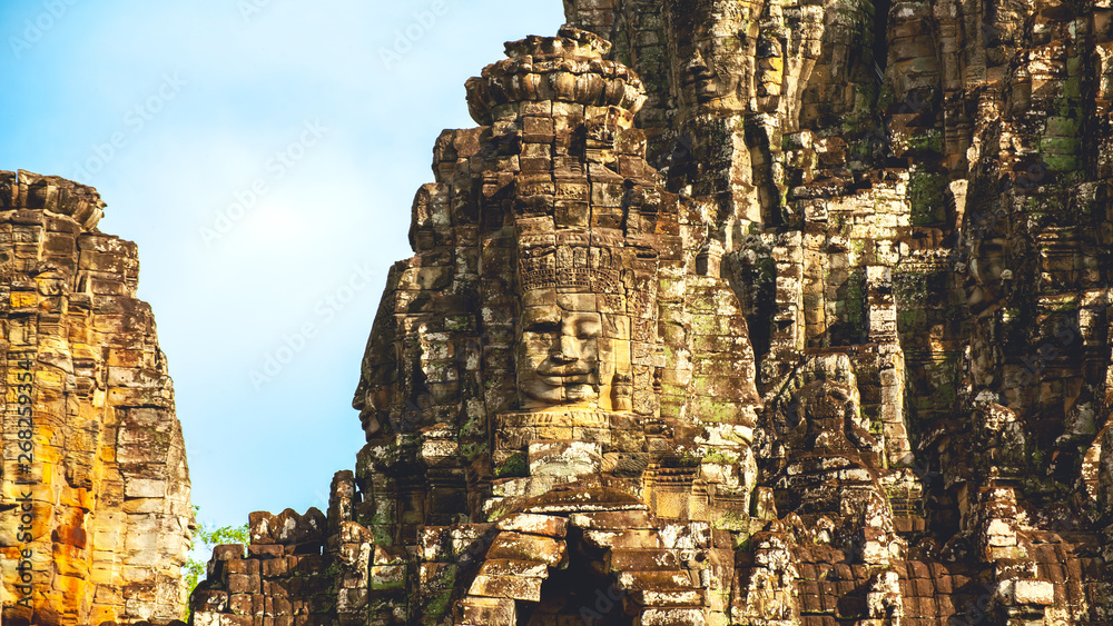 Fototapeta premium The Stone face of Bayon Castle . Khmer ancient Angkor Wat in Siem Reap, Cambodia