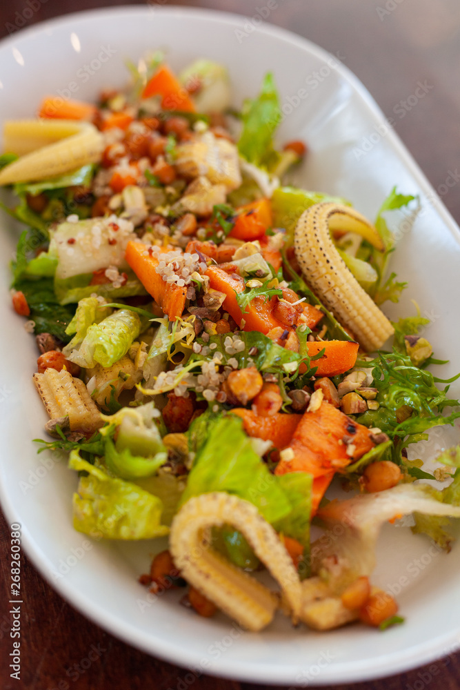 Vegan salad with greens, mini-corn, chickpea and quinoa Vegan salad with greens, mini-corn, chickpea and quinoa