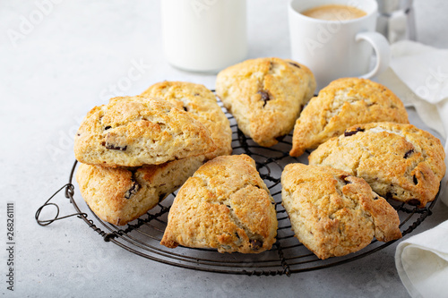 Homemade chocolate chunk scones with coffee for breakfast photo