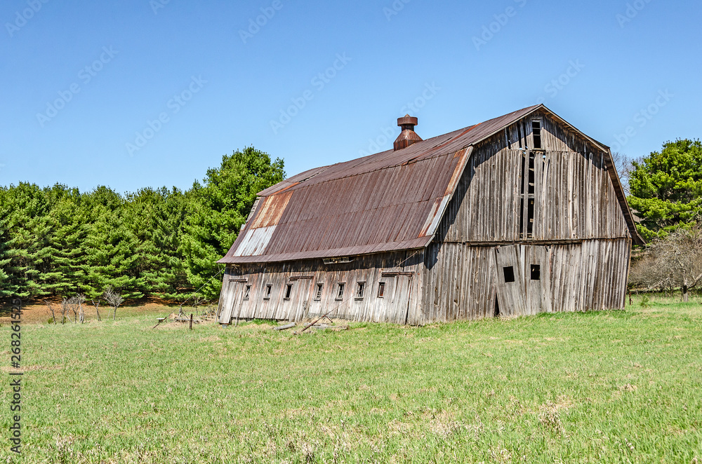 Weathered Gray Barn with Rusty Metal Roof 