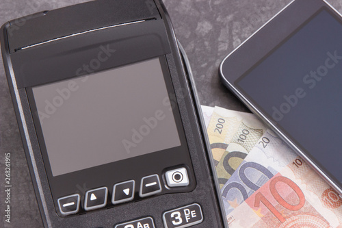 Payment terminal, money and smartphone with NFC technology using for cashless paying in different places