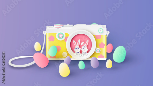 Creative design for camera on Easter festival with cute bunny couple inside camera lens and variety color Easter eggs.  paper cut and craft style. vector, illustration.
