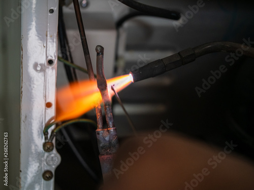 Gas welding using copper brazing rod technique. Welding copper pipes