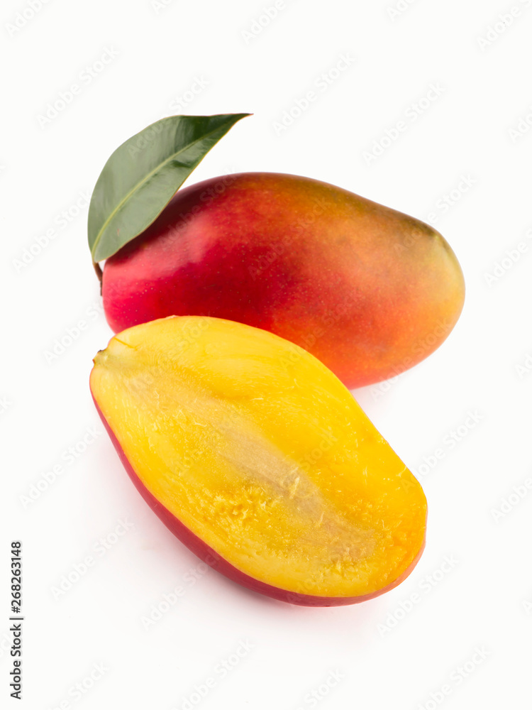 mango slice with green leaves isolated on white background. mango slice with green leaves isolated on white background.