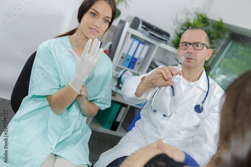 intern putting her gloves for vaccination