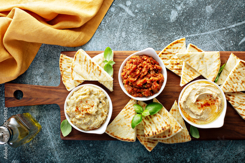 Mediterranean mezze board with pita and dips photo