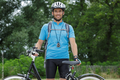 Obraz na plátně portrait of man with his bicycle