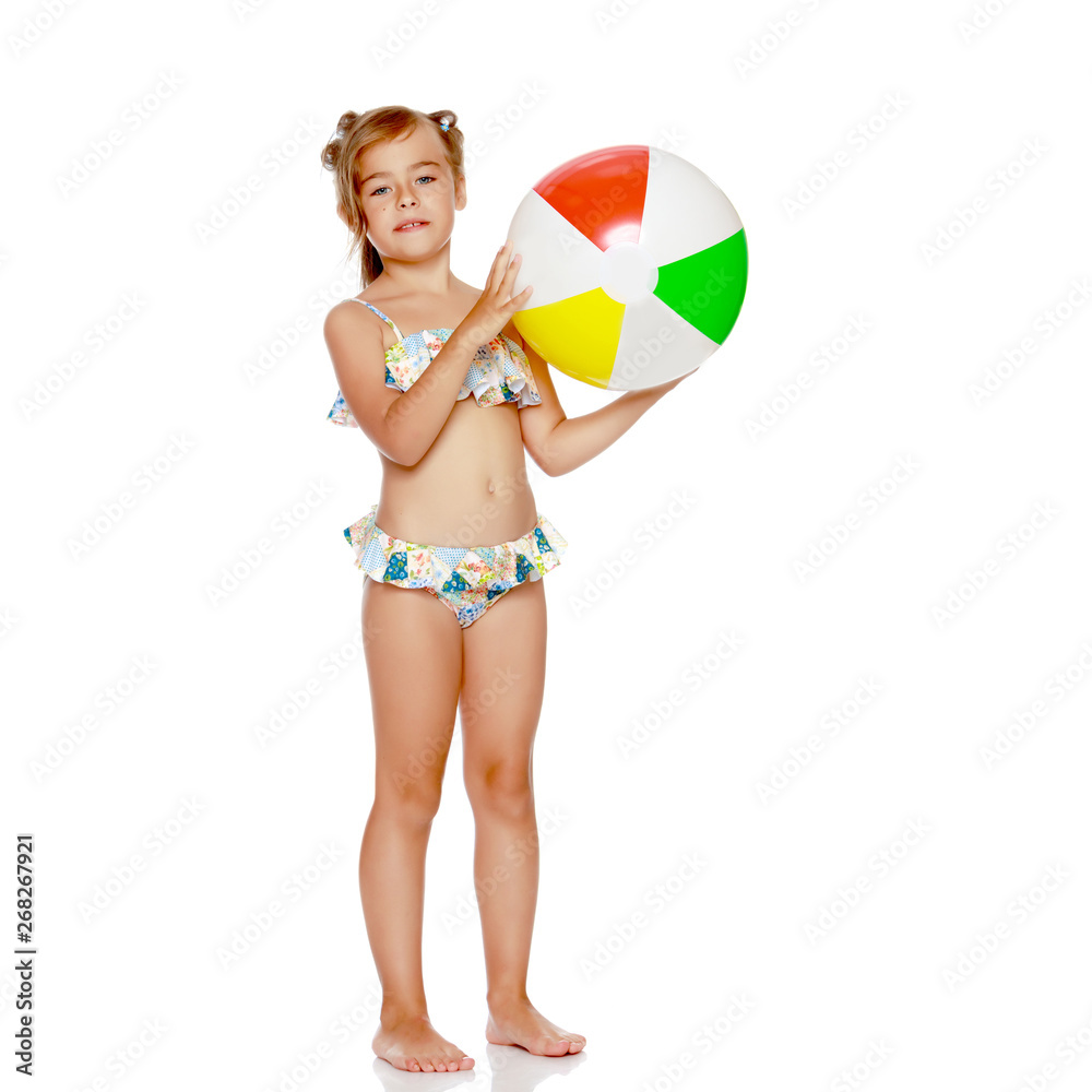 Little girl in a swimsuit with a ball Little girl in a swimsuit with a ball