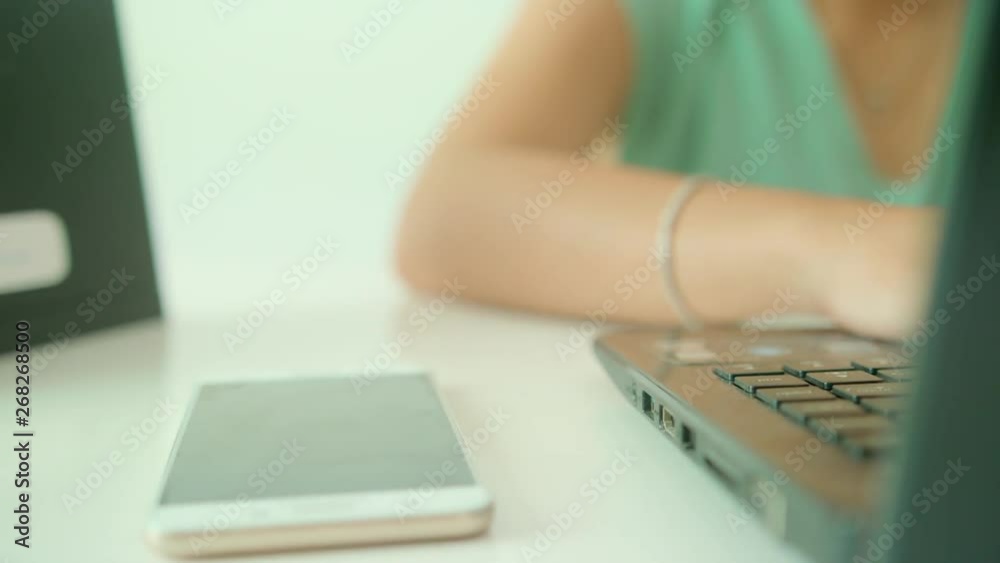 Lady Busy Working On His Desk While Typing On Her Laptop Lady Busy Working On His Desk While Typing On Her Laptop
