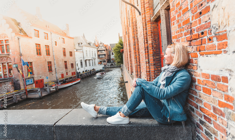 Fototapeta premium Woman tourist in Bruges. Country Sightseeing, Travel to Belgium