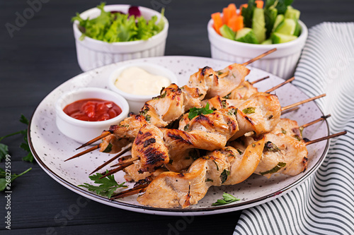Chicken shish kebab. Shashlik - grilled meat and fresh vegetables.