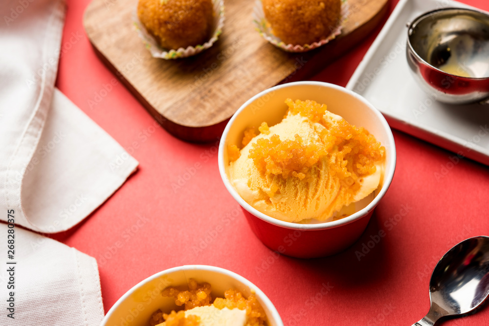 Bundi / Motichoor Ice cream is a fusion of Ice-cream with indian traditional sweet motichur laddoo from India, selective focus Bundi / Motichoor Ice cream is a fusion of Ice-cream with indian traditional sweet motichur laddoo from India, selective focus