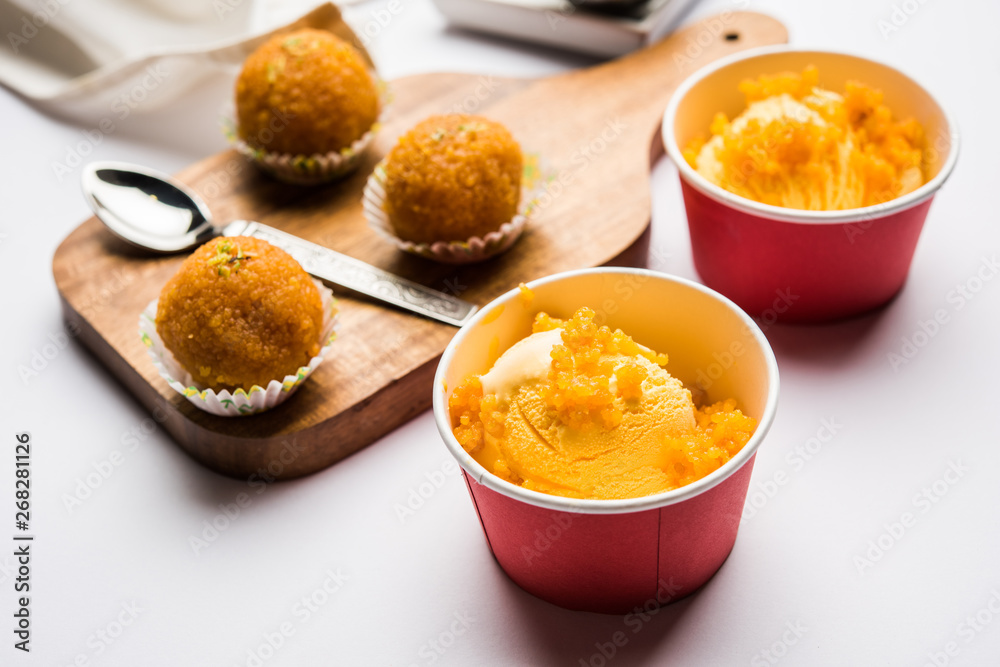 Bundi / Motichoor Ice cream is a fusion of Ice-cream with indian traditional sweet motichur laddoo from India, selective focus Bundi / Motichoor Ice cream is a fusion of Ice-cream with indian traditional sweet motichur laddoo from India, selective focus