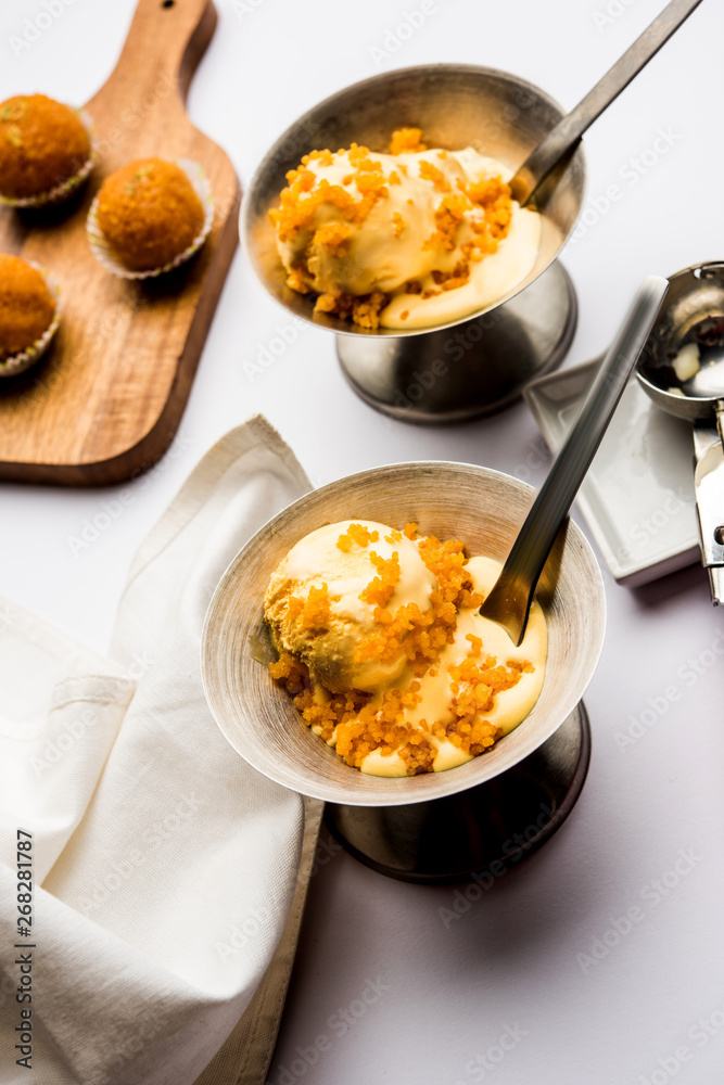 Bundi / Motichoor Ice cream is a fusion of Ice-cream with indian traditional sweet motichur laddoo from India, selective focus Bundi / Motichoor Ice cream is a fusion of Ice-cream with indian traditional sweet motichur laddoo from India, selective focus