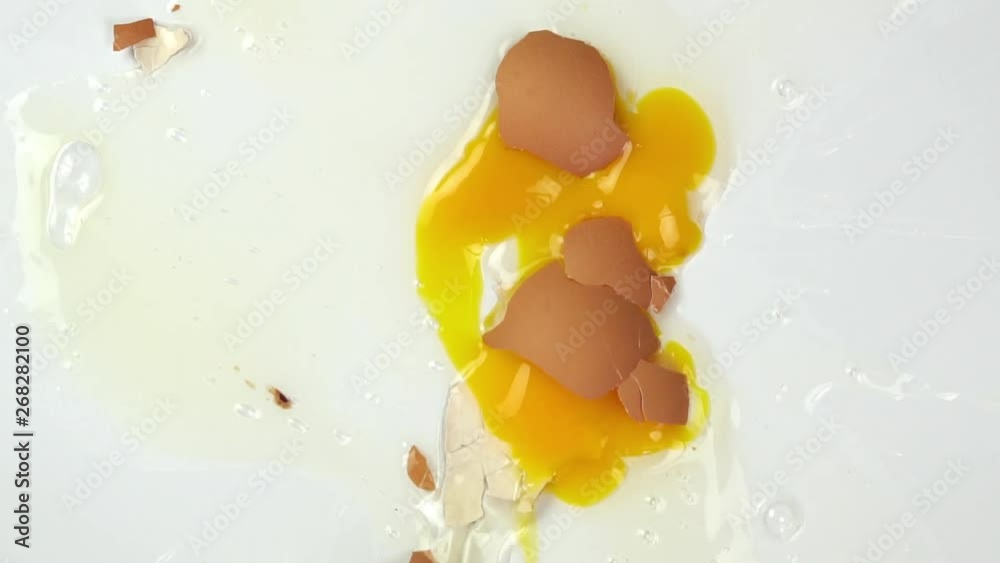 The eggs fall on white background, Slow motion