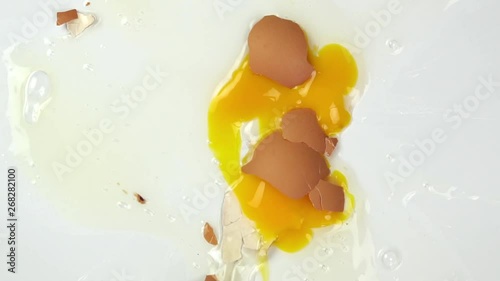 The eggs fall on white background, Slow motion photo