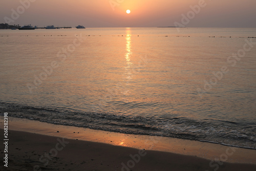 Sunrise in the Red Sea. Reflection of rays of sun light in the morning. Positive inspirational illustration great for your backdrop of layout.
