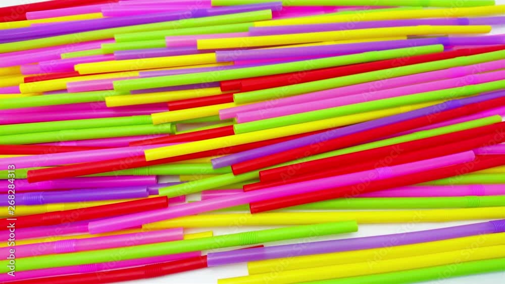 Slide shot of colourful plastic straws drinking, Stop single use straws banned in EU, save global environment concept.