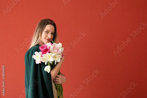 Young woman with bouquet of...