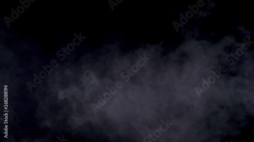 Banana throwing. Smoked black background. Slow motion