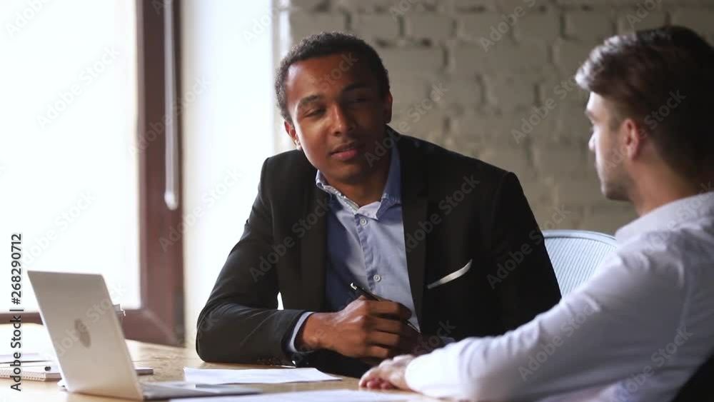 African american professional manager consultant advisor talk to caucasian client