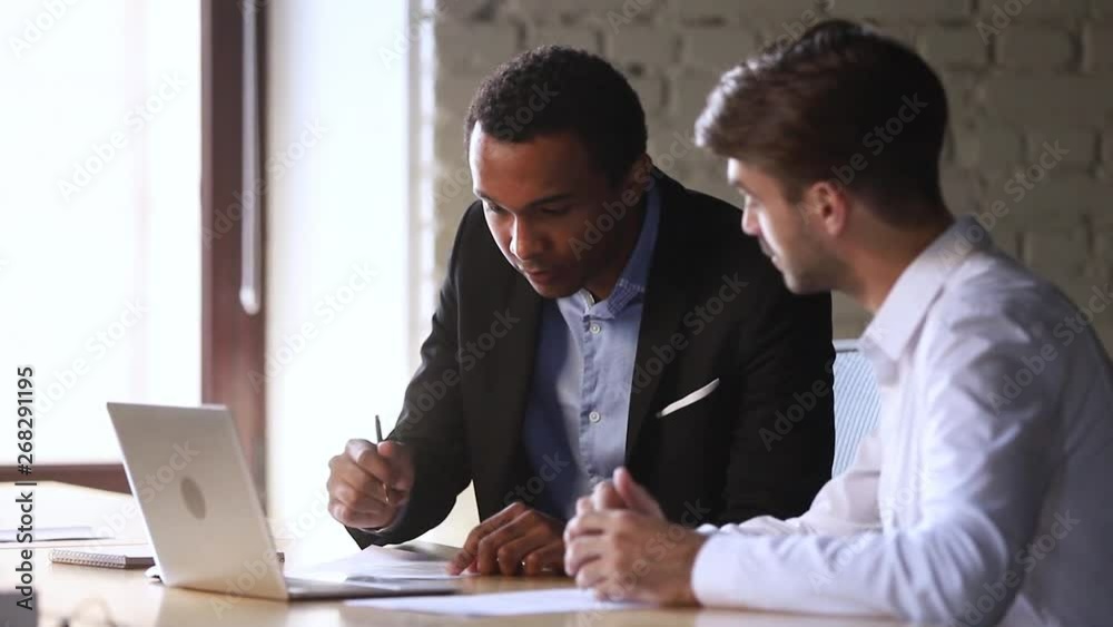 Happy african client handshake caucasian manager sign business contract