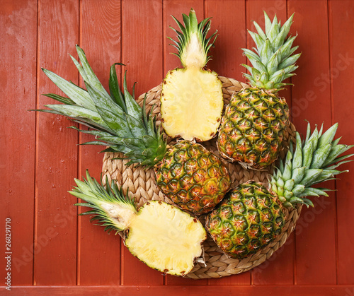 Ripe pineapples on wooden background
