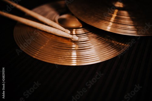 Cymbals on the dark background photo
