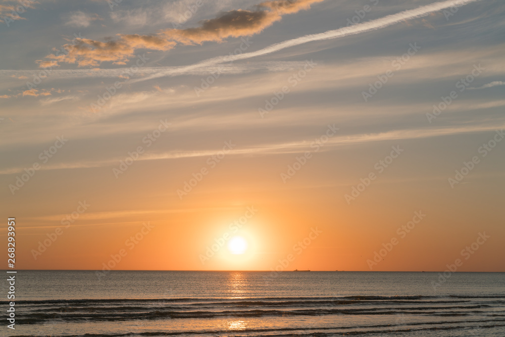 Fototapeta premium Very beautiful view of the sea coast at sunset. The Baltic Sea is washed by a sea wave.