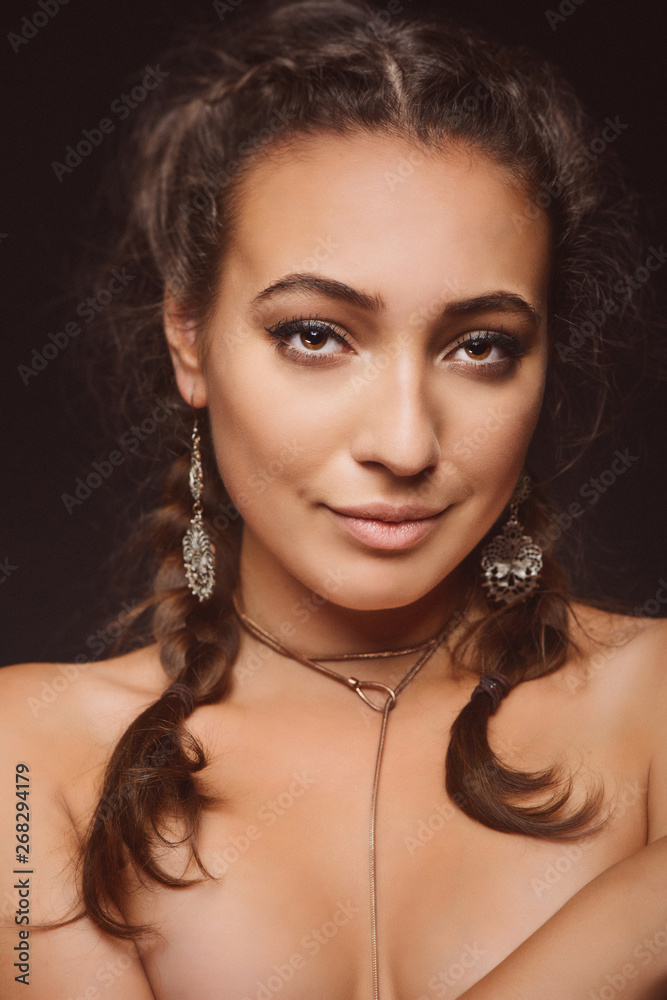 Portrait of young woman on dark background Portrait of young woman on dark background