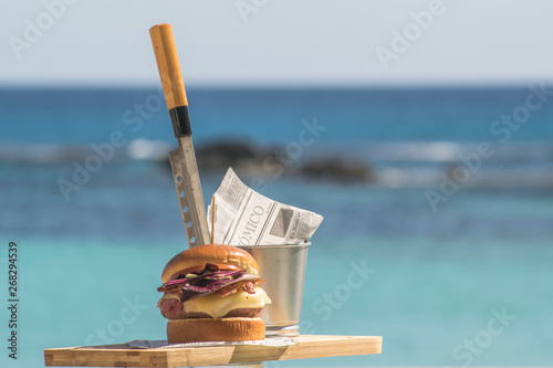 hamburger with turquoise sea background