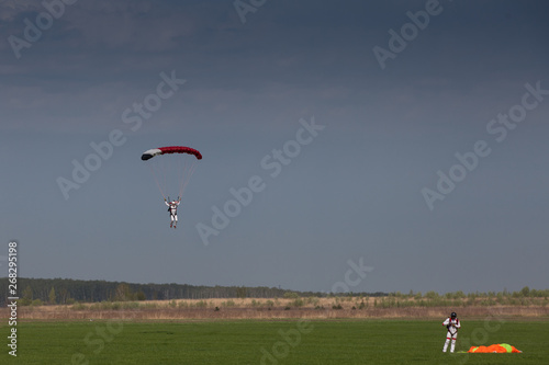 Skydive, people in the sky, under clouds © acidbeast