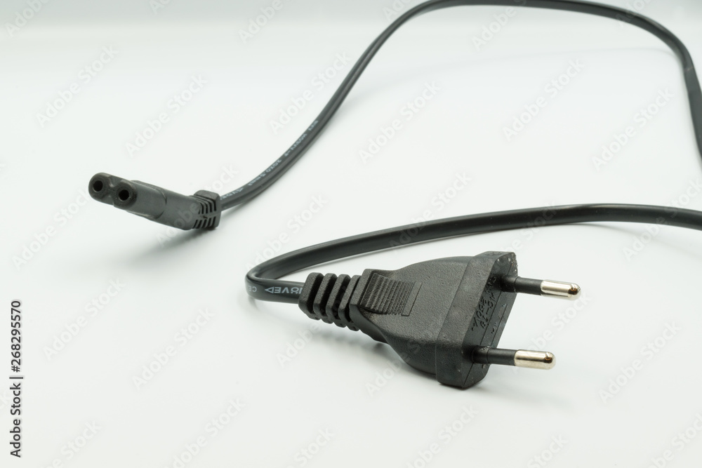 This is a capture for an AC black power cord the picture is taken with a white background and a studio light This is a capture for an AC black power cord the picture is taken with a white background and a studio light
