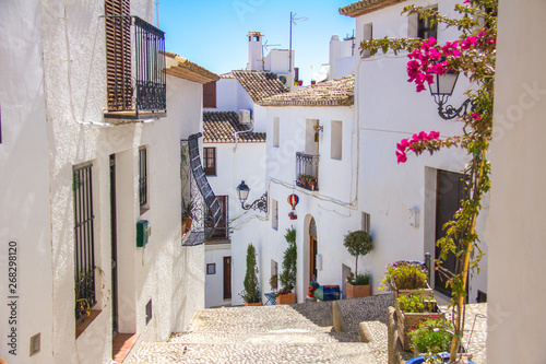 A traditional mediterranean street in Altea old town, Spain photo