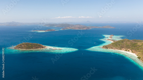 aerial seascape Lagoons with blue, azure water in middle of small islands. Palawan, Philippines. tropical islands with blue lagoons, coral reef. Islands of the Malayan archipelago with turquoise