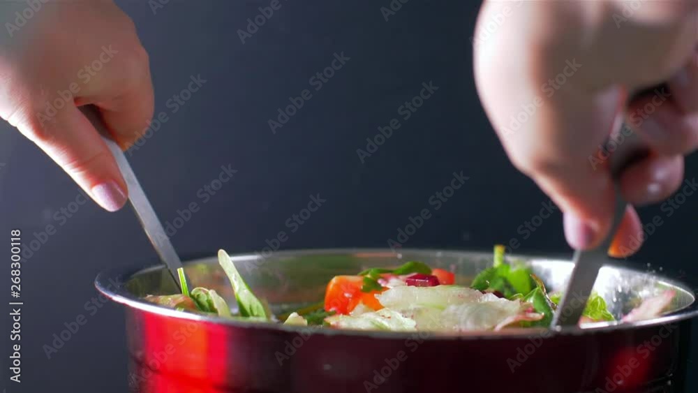 Stirring the fresh salad. Salad with beets and baby spinach Stirring the fresh salad. Salad with beets and baby spinach